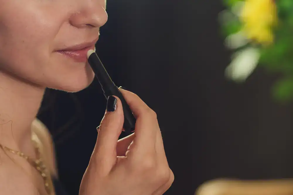 Applying conditioning balm to leather with a cloth