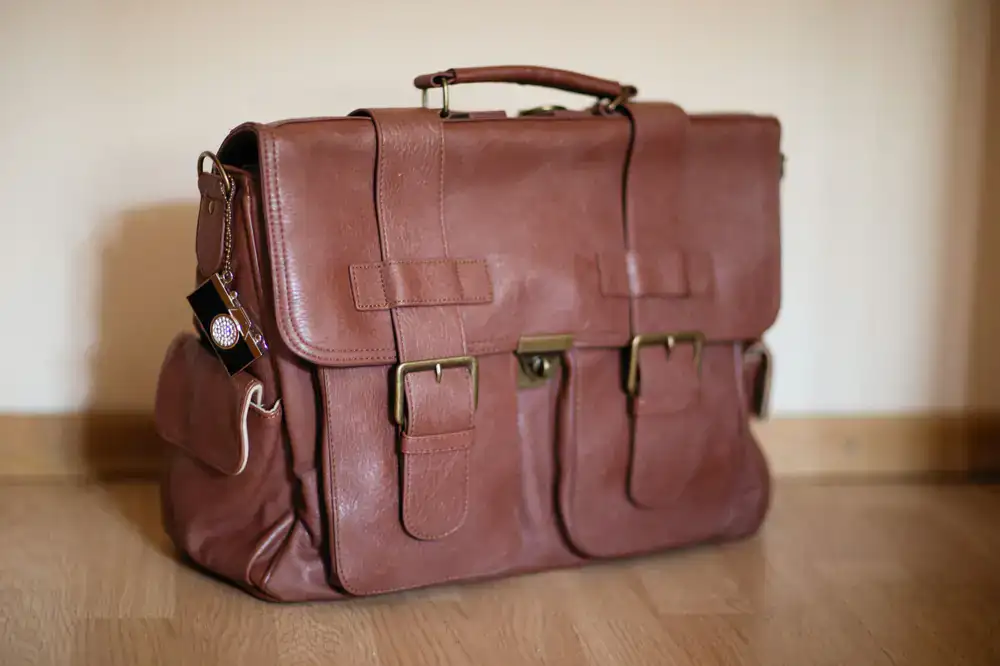 Handcrafted leather satchel with solid brass buckles