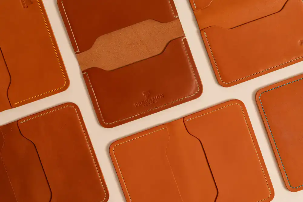 Stack of hand-stitched minimal leather cardholders
